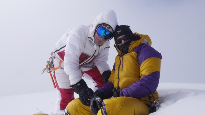 Climbers on a foggy summit