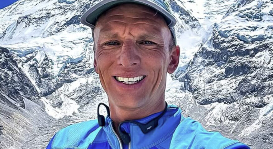Close shot of Karl Egloff with Everest behind him.