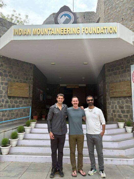 US climbers posing with local LO at the gates of the India's Mountaineering Foundation