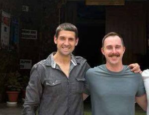 US climbers posing with local LO at the gates of the India's Mountaineering Foundation