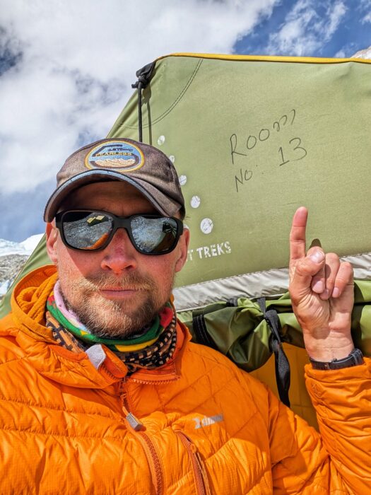 Close shor of Saulius Damulevicius with cap and sunglasses.