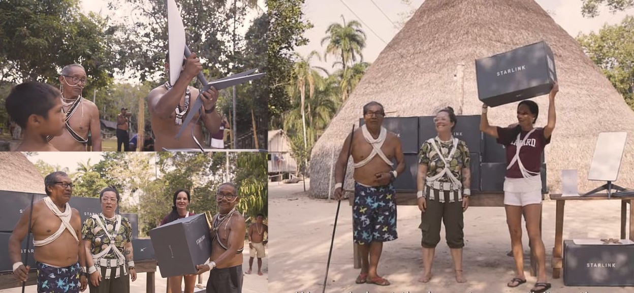 People in traditional Marubo clothing holding boxes labelled 'Starlink'.