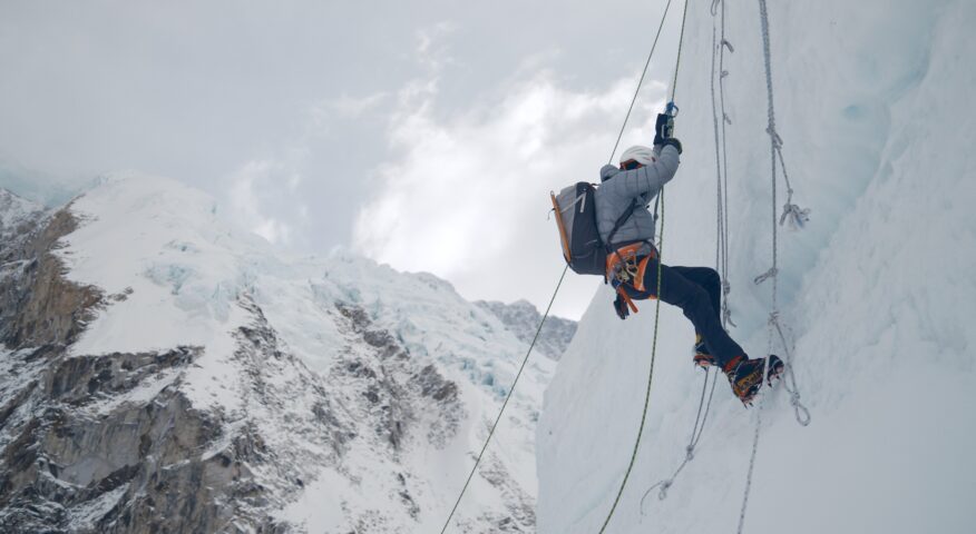 A climber jumaring on a vertical serac on Everest.
