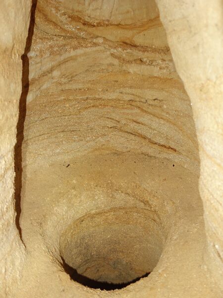 claustraphobic hole in cave