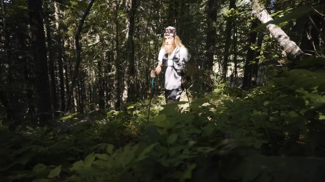 man running in the woods