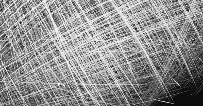 satellite light trails crisscrossing