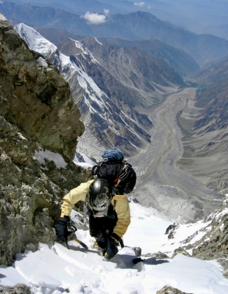 Irena Mrak at 7,500m in the final gully leading to the upper Southwest (Mazeno) Ridge. Below, flowing northwest, is the rubble-covered Diamir Glacier.