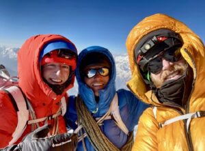 From left to right: Ethan Berman, Sebastian Pelletti and Maarten van Haeren on the summit of Ultar Sar.
