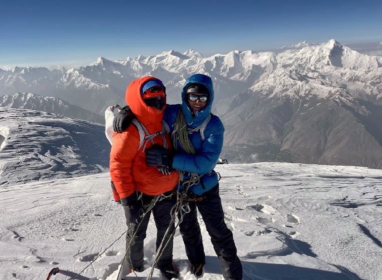 Ethan Berman and Sebastian Pelletti on the summit of Ultar Sar. Diran peak in the background.