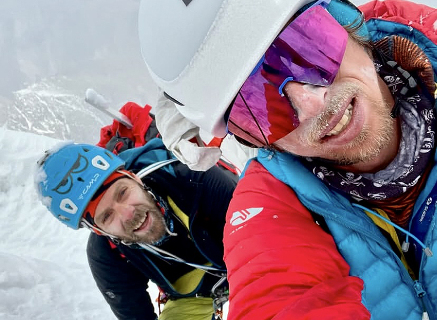 self portrait of two mountaineers in helmets
