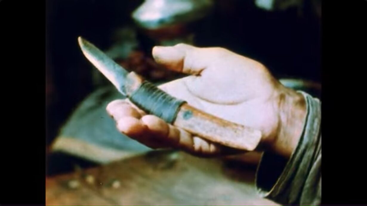 A hand holding a knife
