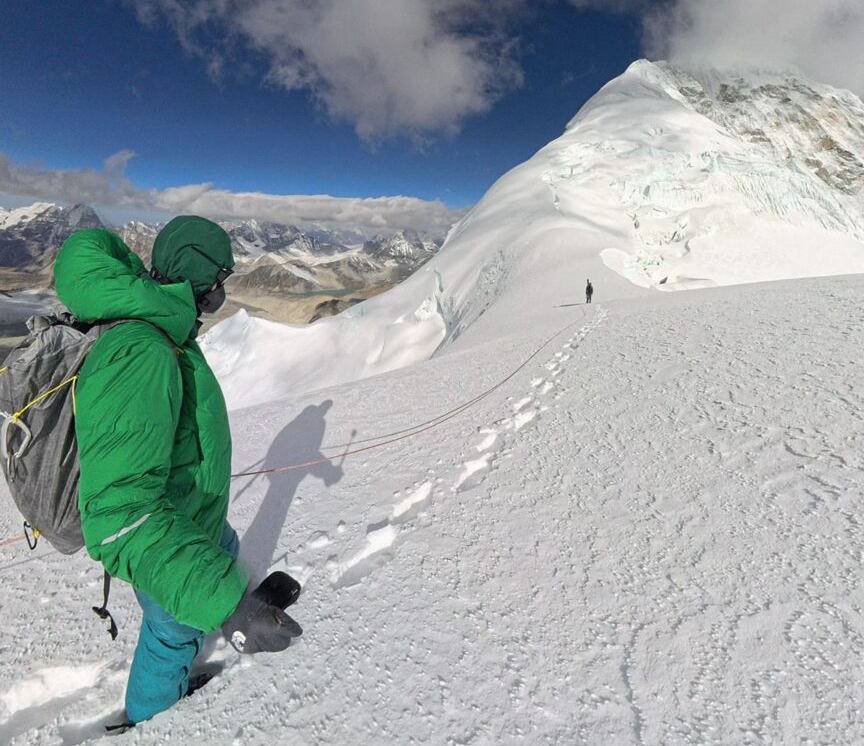 A climber nearing a snow ridge on Baruntse.