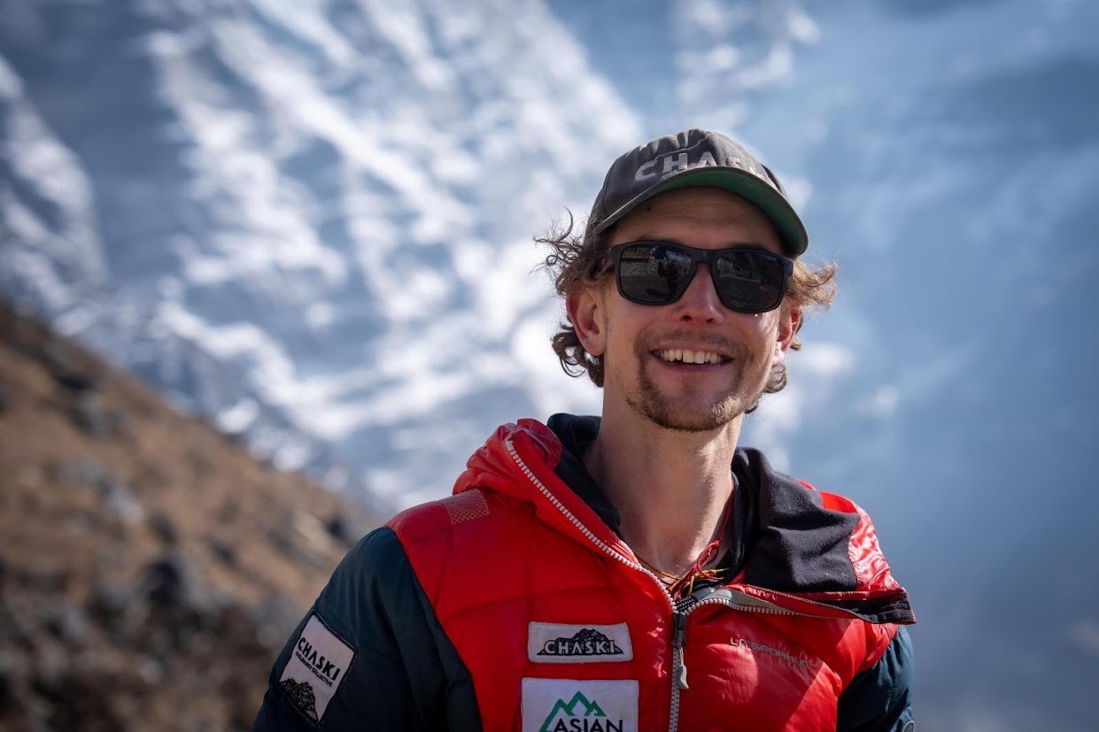 Close shot of tyler Andrews with sunglasses and baseball cap.