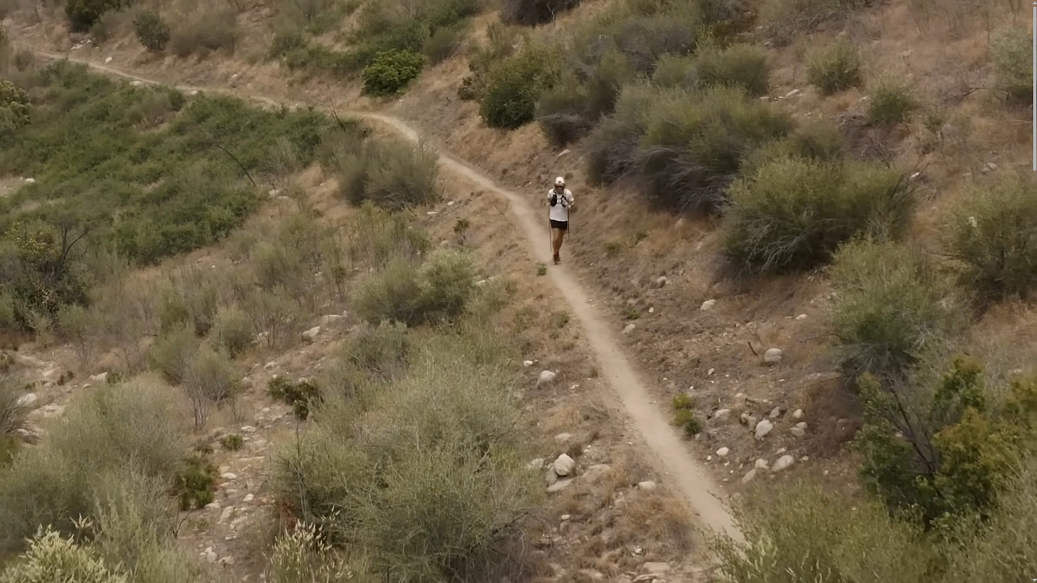 drone shot of runner in desert