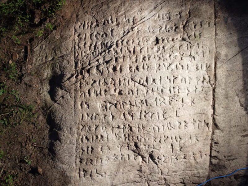 runes carved into a rock
