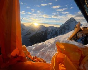 The sun from a high camp on Broad Peak.