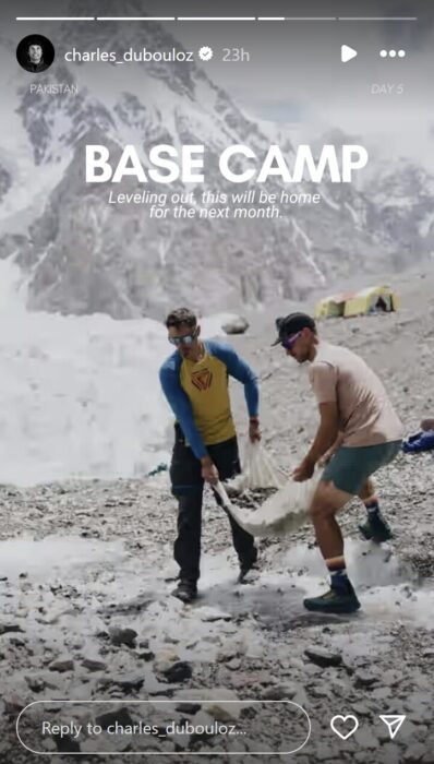IG story with a photo of two climbers carrying a pile of rocks on a piece of fabric.