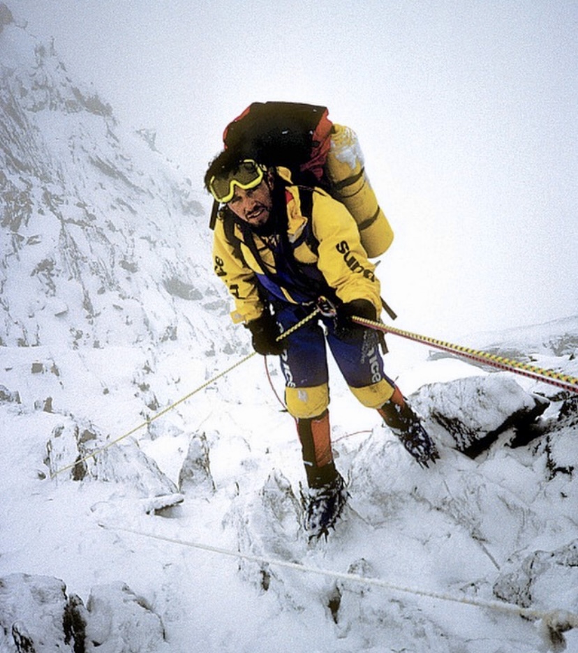 Barry Blanchard rappelling the Rupal Face after an avalanche and storm.