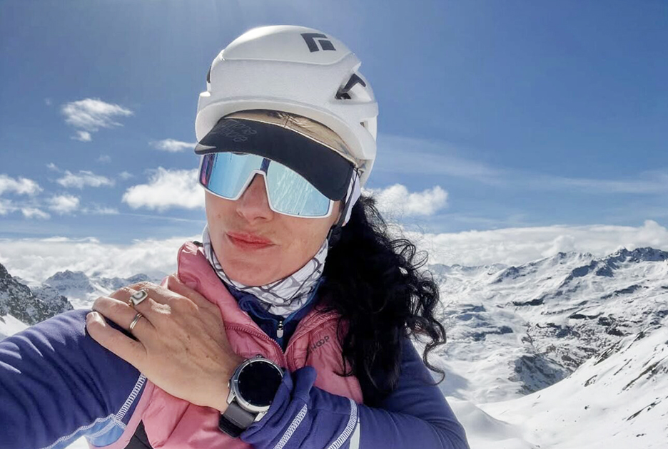 portrait of woman climber on a summit