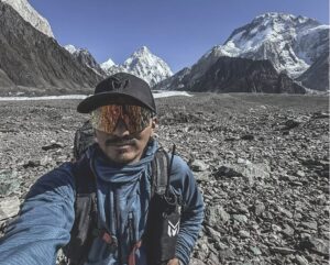 Mingma David takes a selfie at Concordia with K2 in background.