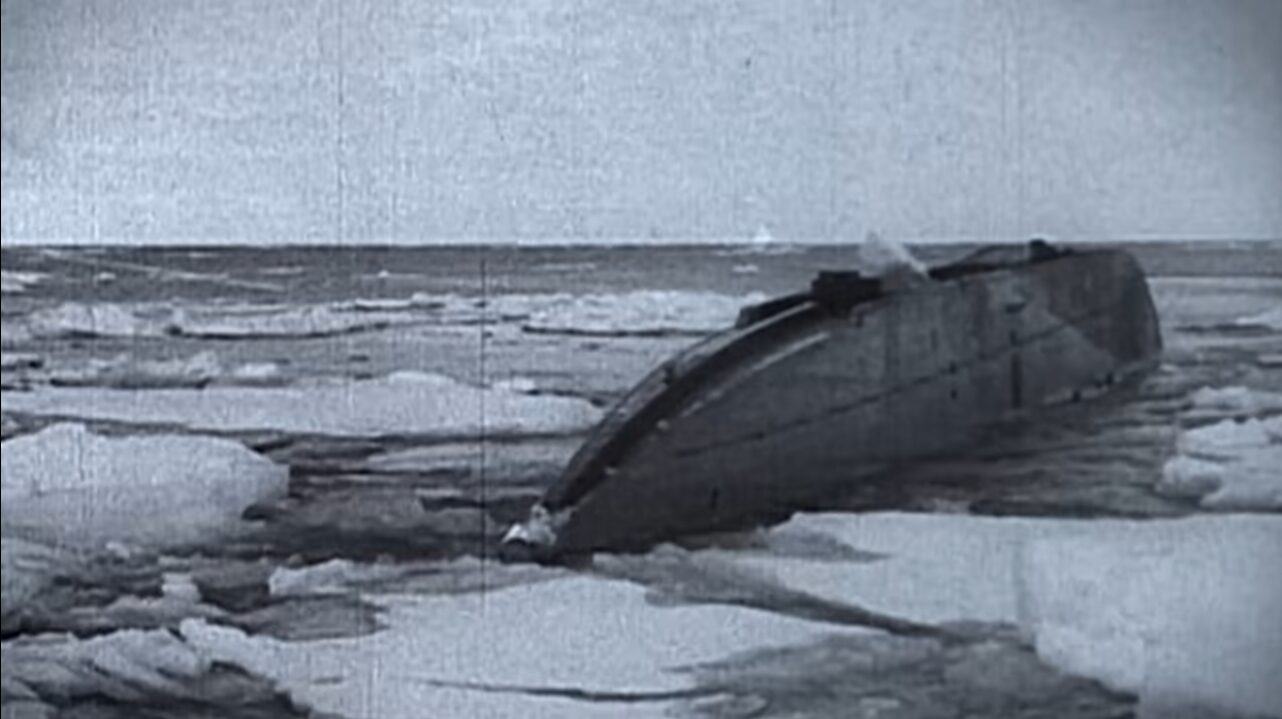 Archival footage still of a submarine in the Arctic