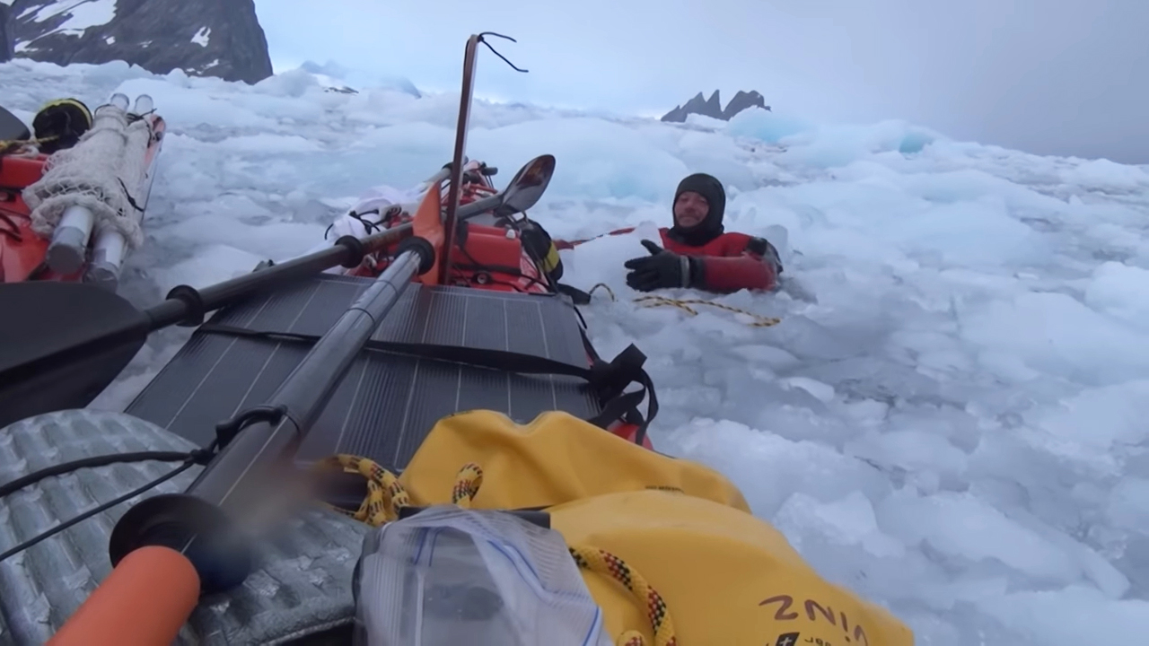 diver in an ice soup of bergy bits