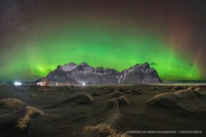 An aurora over a mountain range.