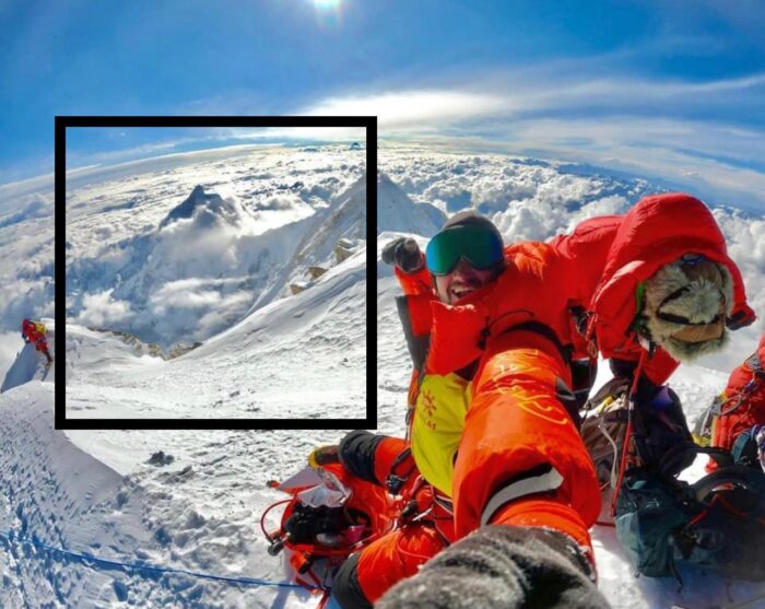 Shehroze kashif on a summit, a piece of the landscape marked. 