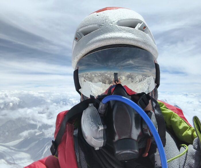 Selfie by the climber with helmet, mirror goggles and O2 mask on.