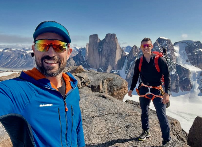 The McCann Brothers on the summit of the unnamed peak, and Mount Asgard in the background.