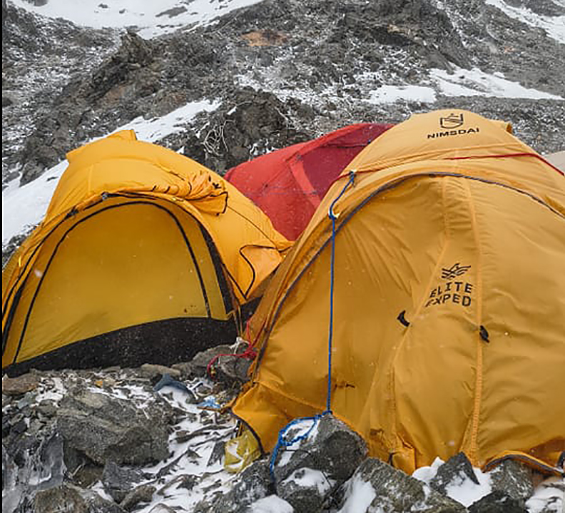 dome tents on rocky ground