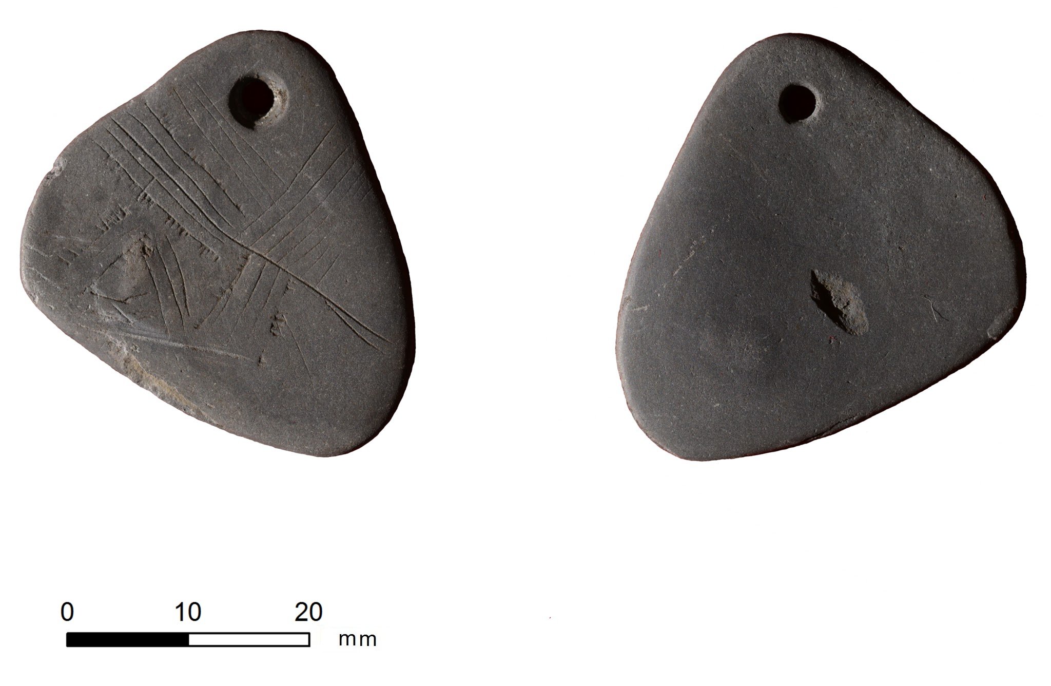 Two sides of a shale pendant.