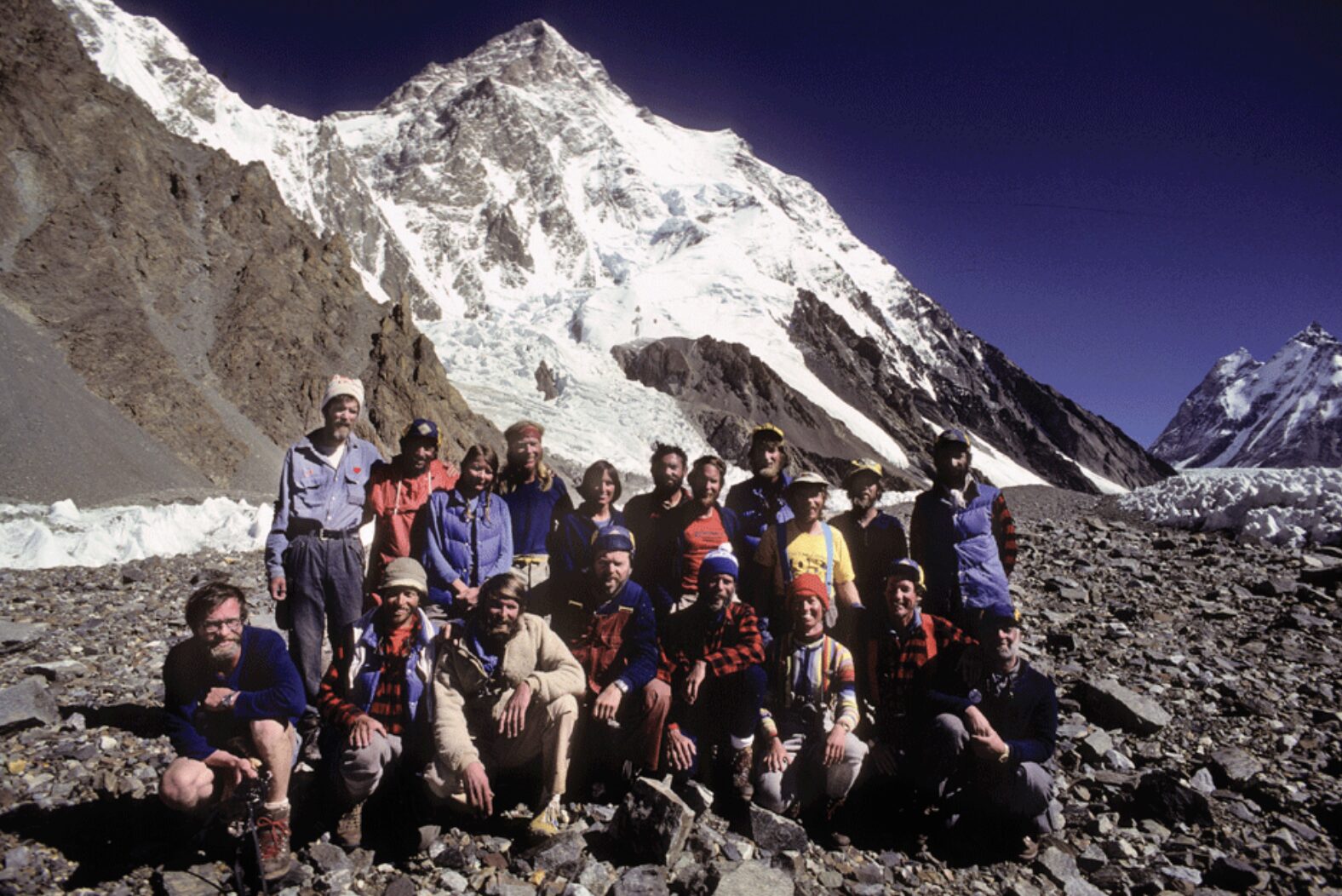 climbers in 1970¡s clothes pose in front of k2.