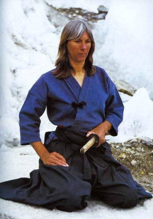 Tullis dressed in a kimono and with a katana, among glacier snow.