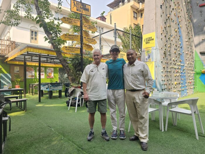 Tyler andrews at an outdoor premise in Kathmandu with Batard and Kazy Sherpa.