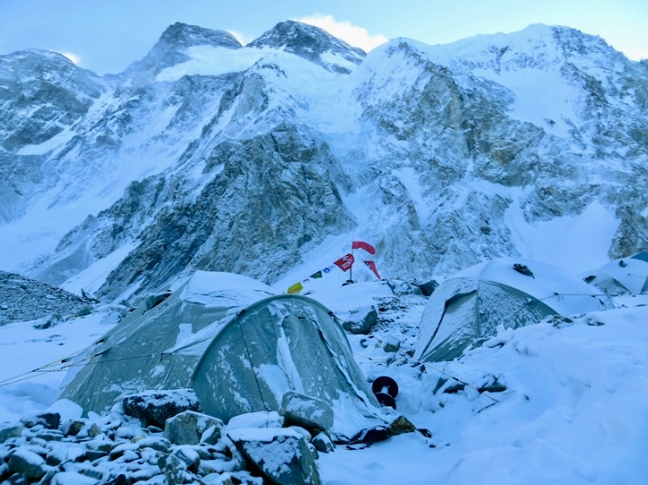 Broad Peak, winter, 2013. Base Camp after a storm. The normal route on Broad Peak, followed by the first winter ascensionists, climbs to the prominent col (above the foreground tent) and then up to the main summit on the right.
