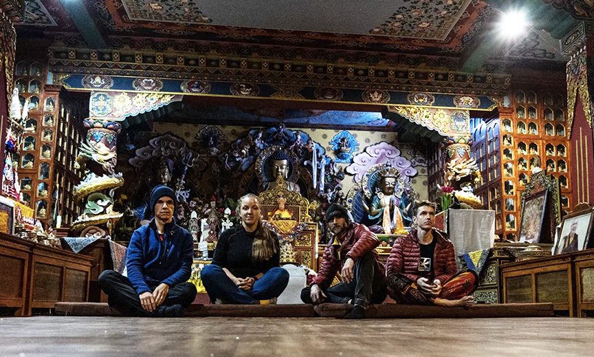 Andrey Vassiliev, left, and his team in a temple during the approach trek to Manaslu.