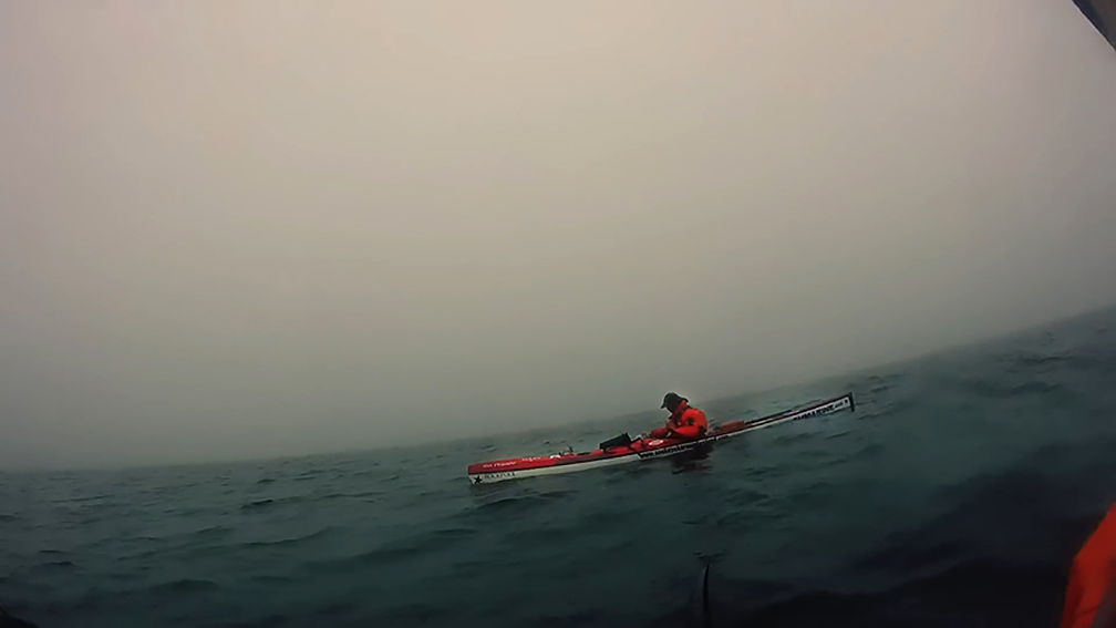 kayak in dark thick fog
