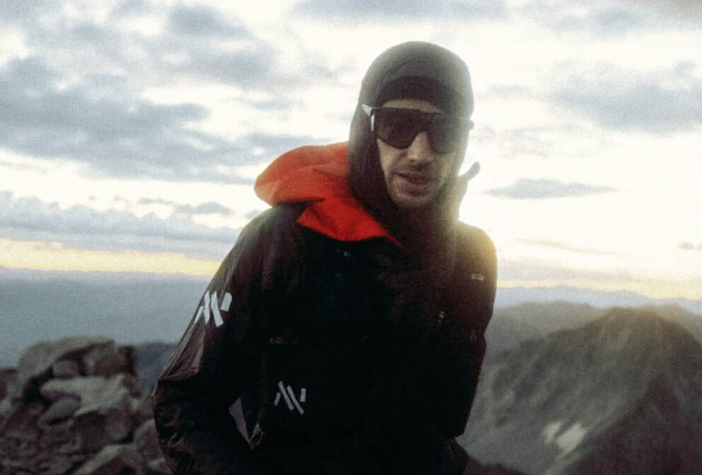 Kilian Jornet with sunglasses and a hood on.