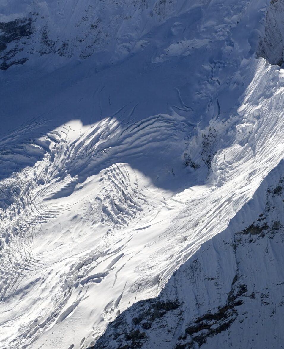 The glacial slope of Anidesh Chuli, on crevassed snow and ice, in the sun. 