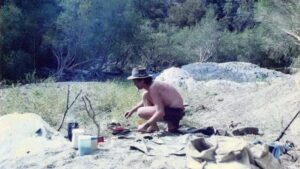 A man at a camp in the bush