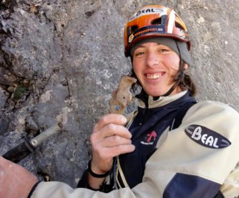 smiling climber in helmet