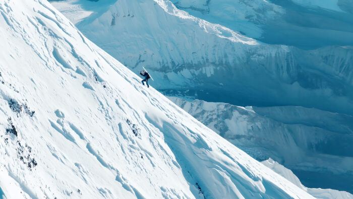 Bargiel walking up on the edge of a snow ridge on Everest.