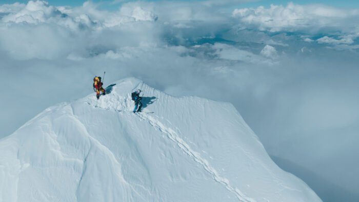 Bargiel and Dawa on the summit of Everest, completely covered in snow.