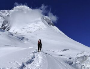 climber moving up through fresh snow