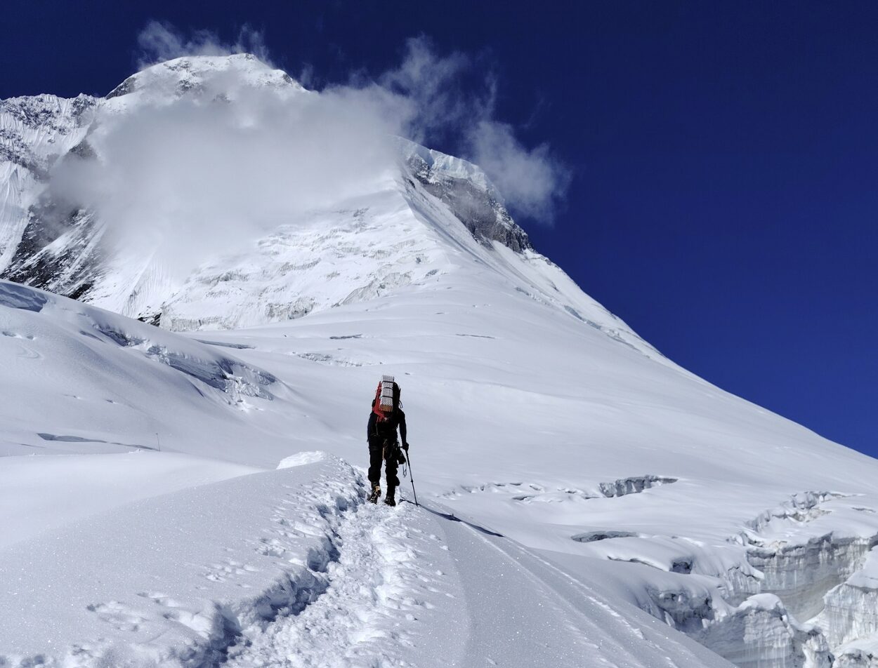 climber moving up through fresh snow