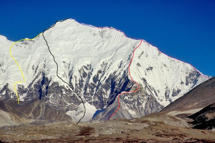 Routes marked in diffrent colors on a photo of Everest's East face.