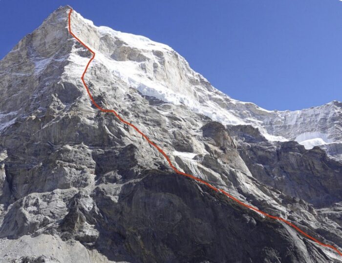 A peak with a route marked up one of its ridges.