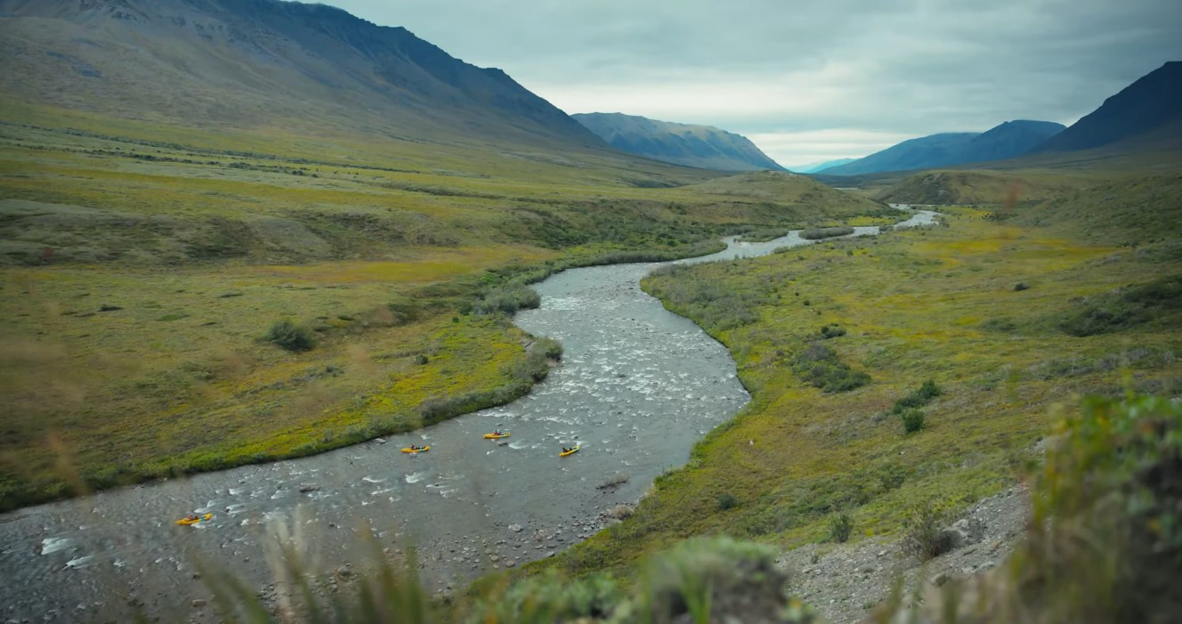 A group of paddlers in a stream