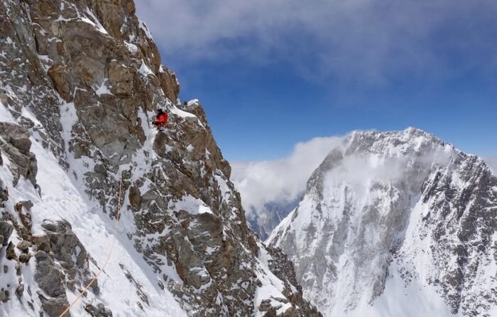 A climber on a difficult mixed wall.
